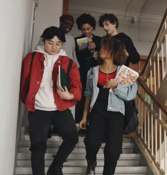 Students leaving the school down the stairs