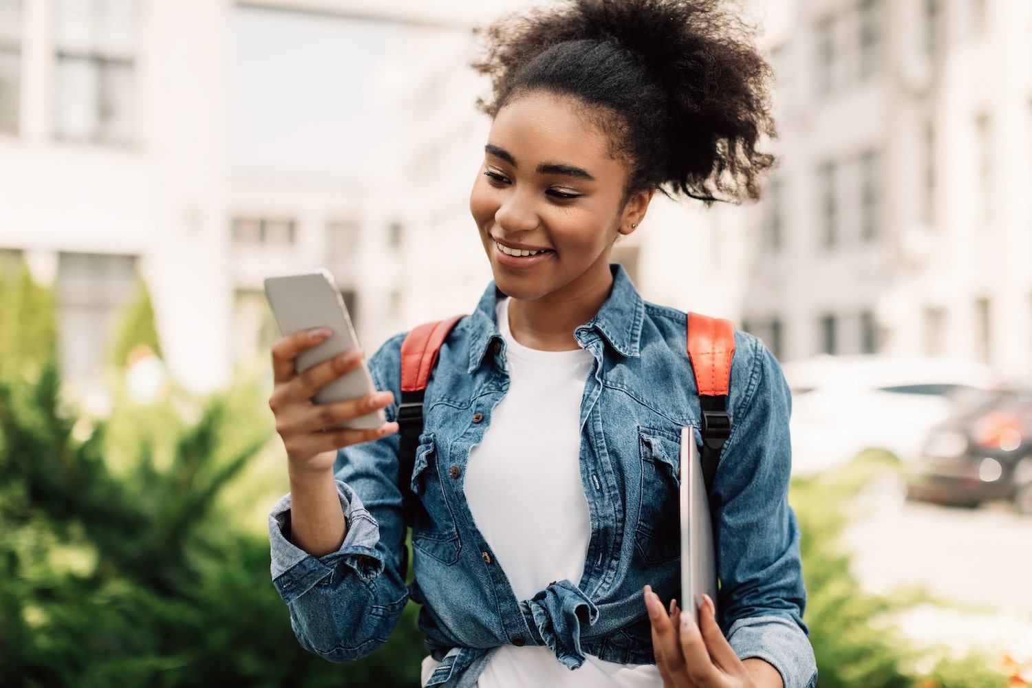 Happy College Girl Using Smartphone Texting Outdoor